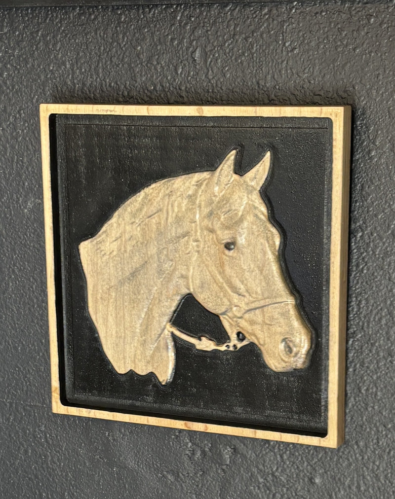 Framed carved wood horse head portrait, pale carving on a dark ground — Grain & Memory Studio